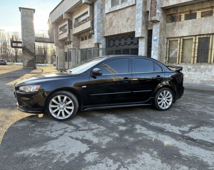 Черный Мицубиси Лансер, объемом двигателя 2 л и пробегом 236 тыс. км за 6550 $, фото 1 на Automoto.ua