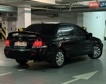Чорний Міцубісі Lancer, об'ємом двигуна 1.58 л та пробігом 212 тис. км за 5500 $, фото 5 на Automoto.ua