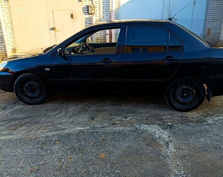 Черный Мицубиси Лансер, объемом двигателя 1.6 л и пробегом 230 тыс. км за 4700 $, фото 4 на Automoto.ua