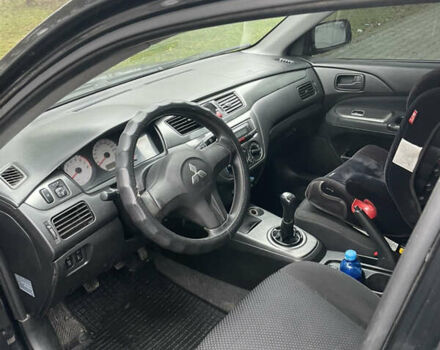 Черный Мицубиси Лансер, объемом двигателя 1.58 л и пробегом 214 тыс. км за 4400 $, фото 18 на Automoto.ua