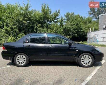 Чорний Міцубісі Lancer, об'ємом двигуна 1.6 л та пробігом 296 тис. км за 4200 $, фото 3 на Automoto.ua
