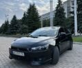 Черный Мицубиси Лансер, объемом двигателя 2 л и пробегом 165 тыс. км за 7300 $, фото 1 на Automoto.ua