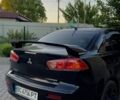 Черный Мицубиси Лансер, объемом двигателя 2 л и пробегом 290 тыс. км за 6000 $, фото 1 на Automoto.ua