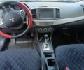 Черный Мицубиси Лансер, объемом двигателя 2 л и пробегом 210 тыс. км за 6250 $, фото 7 на Automoto.ua