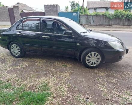 Чорний Міцубісі Lancer, об'ємом двигуна 1.6 л та пробігом 215 тис. км за 4900 $, фото 1 на Automoto.ua