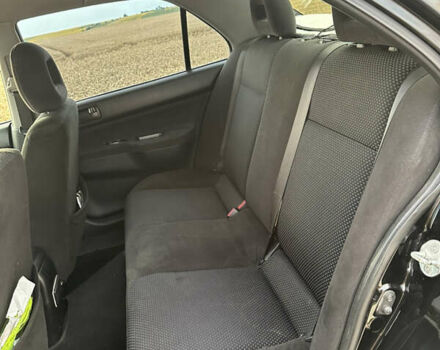 Чорний Міцубісі Lancer, об'ємом двигуна 1.58 л та пробігом 232 тис. км за 4300 $, фото 14 на Automoto.ua