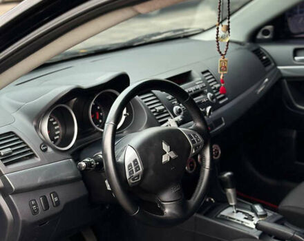 Черный Мицубиси Лансер, объемом двигателя 2 л и пробегом 236 тыс. км за 7950 $, фото 6 на Automoto.ua