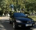 Черный Мицубиси Лансер, объемом двигателя 1.6 л и пробегом 184 тыс. км за 3700 $, фото 1 на Automoto.ua