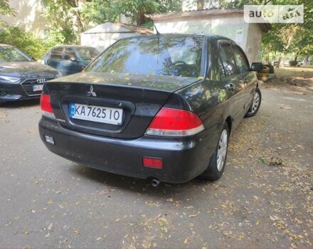 Чорний Міцубісі Lancer, об'ємом двигуна 1.6 л та пробігом 335 тис. км за 3100 $, фото 12 на Automoto.ua