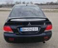 Черный Мицубиси Лансер, объемом двигателя 1.6 л и пробегом 255 тыс. км за 4700 $, фото 4 на Automoto.ua