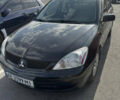 Чорний Міцубісі Lancer, об'ємом двигуна 1.58 л та пробігом 227 тис. км за 5300 $, фото 5 на Automoto.ua