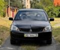 Чорний Міцубісі Lancer, об'ємом двигуна 1.58 л та пробігом 300 тис. км за 2900 $, фото 1 на Automoto.ua