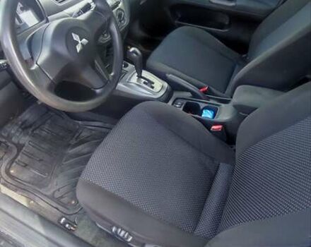 Черный Мицубиси Лансер, объемом двигателя 1.6 л и пробегом 243 тыс. км за 4500 $, фото 13 на Automoto.ua