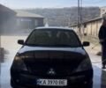 Черный Мицубиси Лансер, объемом двигателя 1.59 л и пробегом 238 тыс. км за 4500 $, фото 1 на Automoto.ua