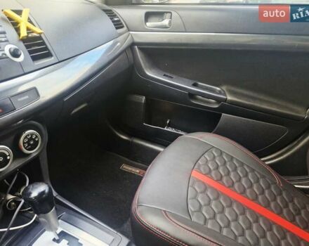 Чорний Міцубісі Lancer, об'ємом двигуна 2 л та пробігом 240 тис. км за 7850 $, фото 29 на Automoto.ua