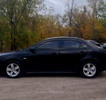 Черный Мицубиси Лансер, объемом двигателя 2 л и пробегом 211 тыс. км за 6900 $, фото 2 на Automoto.ua