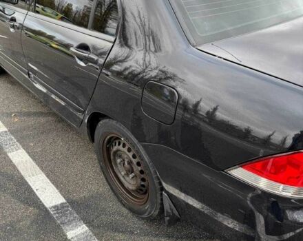 Чорний Міцубісі Lancer, об'ємом двигуна 1.6 л та пробігом 245 тис. км за 4500 $, фото 11 на Automoto.ua