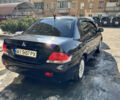 Чорний Міцубісі Lancer, об'ємом двигуна 1.58 л та пробігом 200 тис. км за 6000 $, фото 1 на Automoto.ua