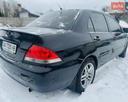 Черный Мицубиси Лансер, объемом двигателя 1.6 л и пробегом 179 тыс. км за 2700 $, фото 5 на Automoto.ua