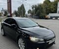 Черный Мицубиси Лансер, объемом двигателя 2 л и пробегом 200 тыс. км за 6800 $, фото 3 на Automoto.ua