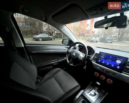 Черный Мицубиси Лансер, объемом двигателя 2 л и пробегом 217 тыс. км за 7000 $, фото 5 на Automoto.ua