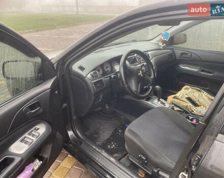 Черный Мицубиси Лансер, объемом двигателя 1.58 л и пробегом 211 тыс. км за 6333 $, фото 34 на Automoto.ua