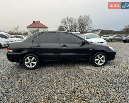 Черный Мицубиси Лансер, объемом двигателя 1.58 л и пробегом 202 тыс. км за 4100 $, фото 3 на Automoto.ua