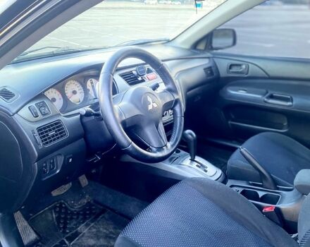 Чорний Міцубісі Lancer, об'ємом двигуна 1.6 л та пробігом 375 тис. км за 4899 $, фото 6 на Automoto.ua