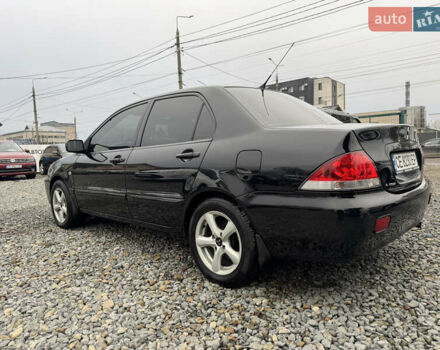 Черный Мицубиси Лансер, объемом двигателя 1.58 л и пробегом 202 тыс. км за 4100 $, фото 15 на Automoto.ua