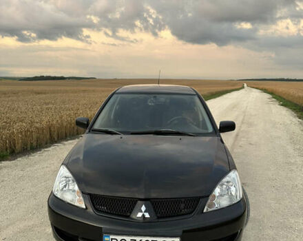 Чорний Міцубісі Lancer, об'ємом двигуна 1.58 л та пробігом 232 тис. км за 4300 $, фото 1 на Automoto.ua
