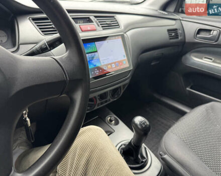 Черный Мицубиси Лансер, объемом двигателя 1.58 л и пробегом 202 тыс. км за 4100 $, фото 7 на Automoto.ua