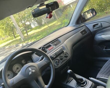 Черный Мицубиси Лансер, объемом двигателя 1.6 л и пробегом 184 тыс. км за 3700 $, фото 6 на Automoto.ua