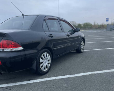 Міцубісі Lancer 2008 у Києві на Automoto.ua Чорний Міцубісі Lancer, об'ємом двигуна 1.58 л та пробігом 300 тис. км за 3800 $, фото 2 на Automoto.ua
