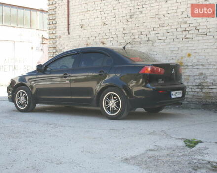 Черный Мицубиси Лансер, объемом двигателя 1.5 л и пробегом 110 тыс. км за 6950 $, фото 8 на Automoto.ua