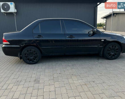 Чорний Міцубісі Lancer, об'ємом двигуна 1.58 л та пробігом 237 тис. км за 4500 $, фото 9 на Automoto.ua
