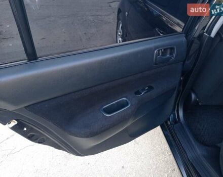 Чорний Міцубісі Lancer, об'ємом двигуна 1.58 л та пробігом 286 тис. км за 4950 $, фото 11 на Automoto.ua