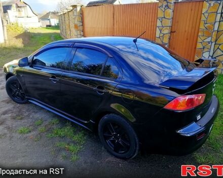 Черный Мицубиси Лансер, объемом двигателя 2 л и пробегом 196 тыс. км за 5500 $, фото 3 на Automoto.ua