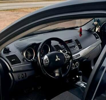 Черный Мицубиси Лансер, объемом двигателя 2 л и пробегом 211 тыс. км за 6900 $, фото 8 на Automoto.ua