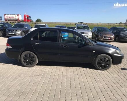 Черный Мицубиси Лансер, объемом двигателя 1.6 л и пробегом 356 тыс. км за 4590 $, фото 9 на Automoto.ua