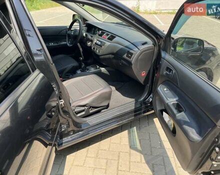 Чорний Міцубісі Lancer, об'ємом двигуна 1.6 л та пробігом 296 тис. км за 4200 $, фото 43 на Automoto.ua