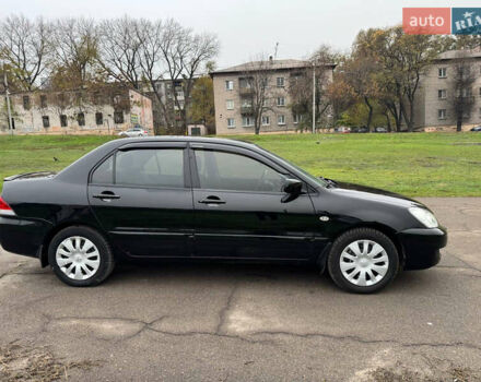 Чорний Міцубісі Lancer, об'ємом двигуна 1.6 л та пробігом 200 тис. км за 4500 $, фото 4 на Automoto.ua