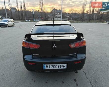 Черный Мицубиси Лансер, объемом двигателя 2 л и пробегом 245 тыс. км за 5600 $, фото 3 на Automoto.ua