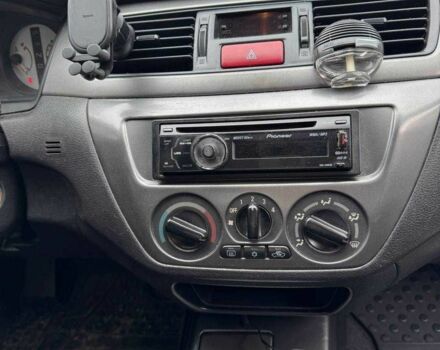 Чорний Міцубісі Lancer, об'ємом двигуна 1.6 л та пробігом 245 тис. км за 4500 $, фото 23 на Automoto.ua