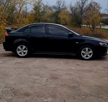 Черный Мицубиси Лансер, объемом двигателя 2 л и пробегом 211 тыс. км за 6900 $, фото 1 на Automoto.ua