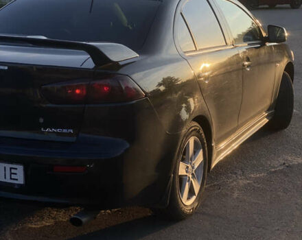 Черный Мицубиси Лансер, объемом двигателя 2 л и пробегом 190 тыс. км за 6750 $, фото 3 на Automoto.ua