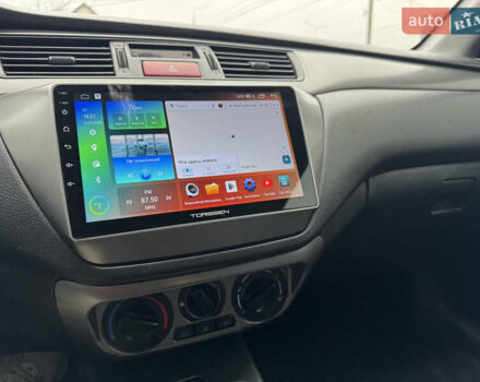 Черный Мицубиси Лансер, объемом двигателя 1.58 л и пробегом 202 тыс. км за 4100 $, фото 6 на Automoto.ua