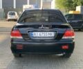 Чорний Міцубісі Lancer, об'ємом двигуна 1.6 л та пробігом 262 тис. км за 3851 $, фото 3 на Automoto.ua
