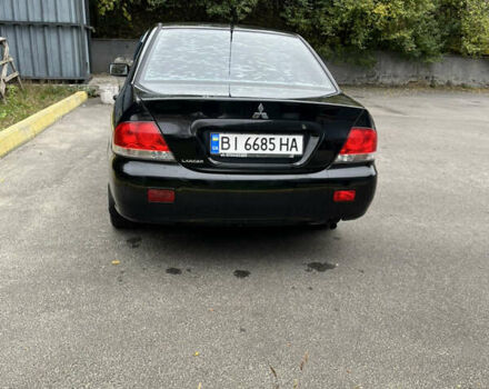 Чорний Міцубісі Lancer, об'ємом двигуна 1.58 л та пробігом 192 тис. км за 4500 $, фото 3 на Automoto.ua