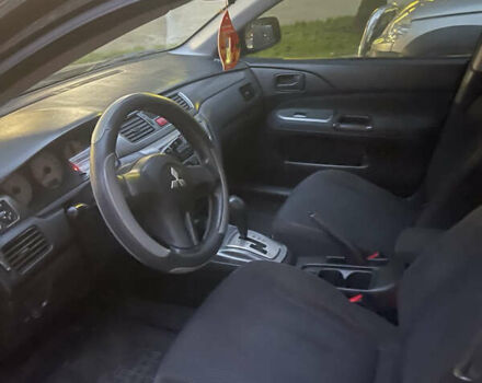 Черный Мицубиси Лансер, объемом двигателя 1.58 л и пробегом 469 тыс. км за 4600 $, фото 2 на Automoto.ua