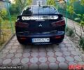 Черный Мицубиси Лансер, объемом двигателя 2 л и пробегом 200 тыс. км за 6600 $, фото 2 на Automoto.ua